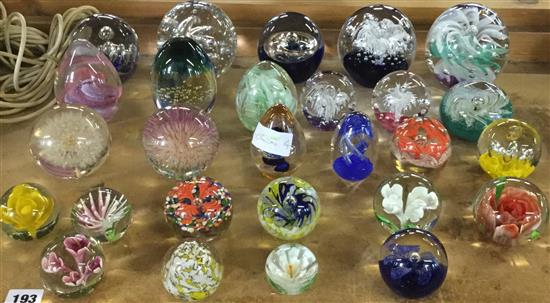Twenty five various glass paperweights